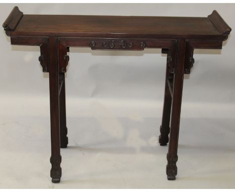 A GOOD QUALITY 19TH CENTURY CHINESE CARVED HARDWOOD ALTER TABLE, with scroll end top, the frieze carved with scroll work, the