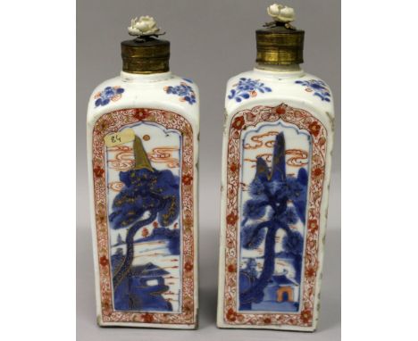 A GOOD PAIR OF CHINESE IMARI KANGXI PERIOD PORCELAIN FLASKS, with brass and ceramic flower covers, the sides of each square-s