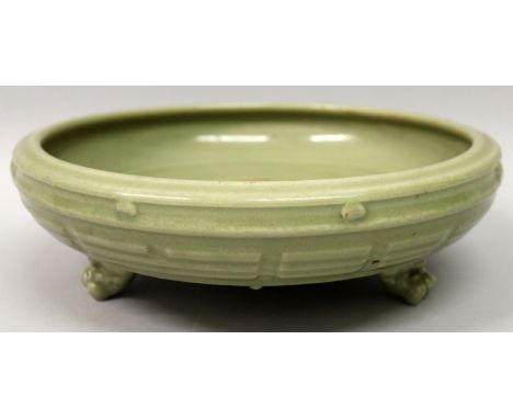 A GOOD CHINESE YUAN/MING DYNASTY LONGQUAN CELADON PORCELAIN TRIPOD CENSER, the sides moulded in relief with the Eight Trigram