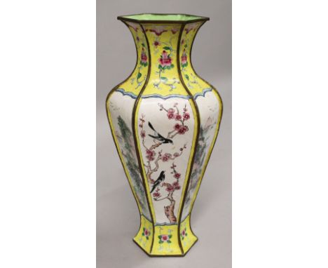 A 20TH CENTURY CHINESE CANTON ENAMEL VASE, the sides of the hexagonal-section body decorated with alternating panels of river