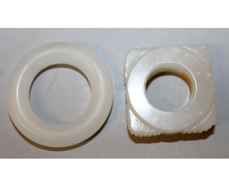 A SMALL HOLLOW WHITE JADE CONG, of archaic form and with russet inclusions, 1.25in square; together with a white jade-like ri
