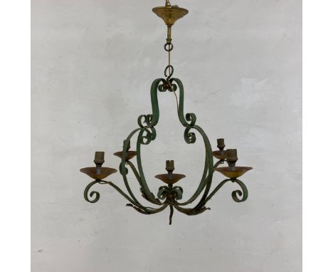 A C.1900 French wrought iron chandelier having a scrolling pear shaped open-work body housing a central candle holder finial 