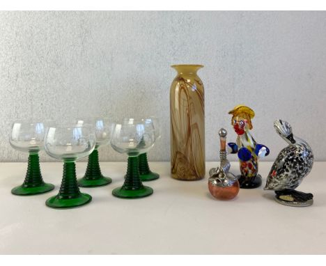A mixed collection to include a signed art glass vase by Anthony Stern, two Murano style figures, a white metal mounted hand 