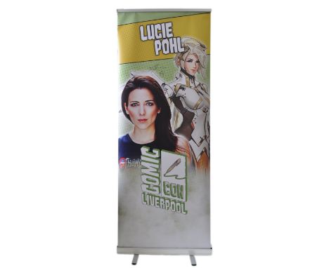 Lucie Pohl - Voice actress to the hero Mercy in video game Overwatch. - autographed Monopoly Events banner from a ' Liverpool