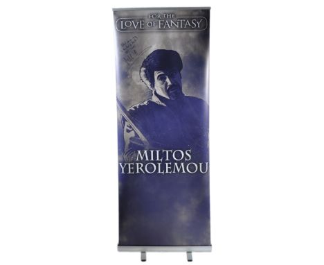 Miltos Yerolemou -Syrio Forel in Game Of Thrones&nbsp; - autographed Monopoly Events banner from a ' For The Love of Fantasy 