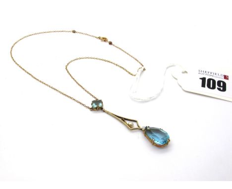 A Dainty Edwardian Drop Necklace, suspending claw set teardrop, stamped "9ct", on fine chain. 