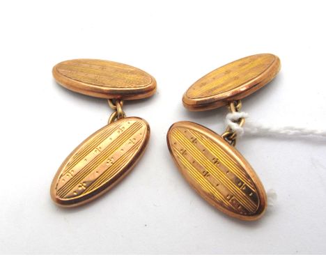 A Pair of 9ct Gold Cufflinks, the engine turned panels on chain connections (2.7grams).  