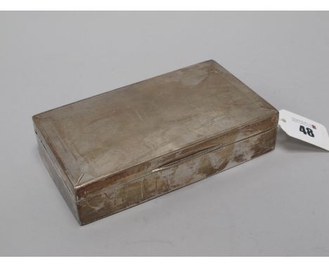 A Hallmarked Silver Cigarette Box, possibly Birmingham 1947 (marks rubbed), of rectangular form with engine turned decoration