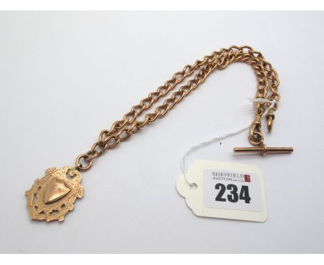 A 9ct Rose Gold Solid Curb Link Albert Chain, to double swivel clasps, suspending a 9ct medallion pendant, 43.5cm long; and a