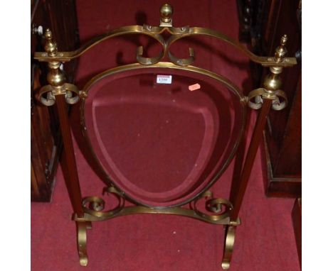 An Art Nouveau style brass framed and bevelled glass inset fire screen, w.55cm
