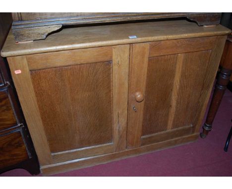 An early 20th century light oak low double door side cupboard, width 103cm