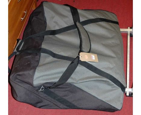 A Cyprinus fisherman's metal framed and canvas upholstered folding chair, in canvas bag; together with an aluminium bracket (