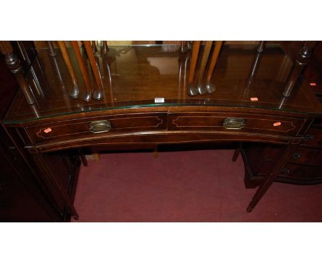 A reproduction mahogany concave two drawer side table, w.107cm; together with a reproduction mahogany console table; a walnut