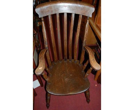 An early 20th century elm and beech slatback farmhouse open armchair; together with a mahogany commode stool (2)