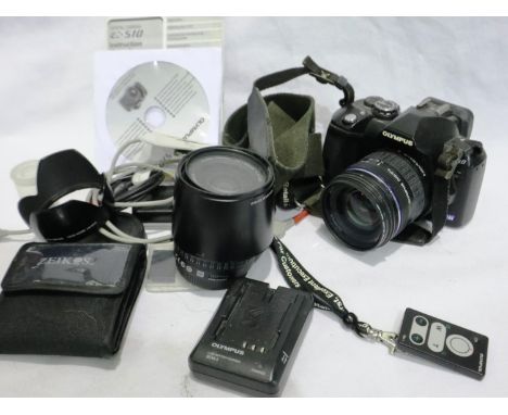 Olympus E510 digital camera with accessories and an Olympus digital, 40-150mm, 1:4-5.6 ED lens. Not available for in-house P&