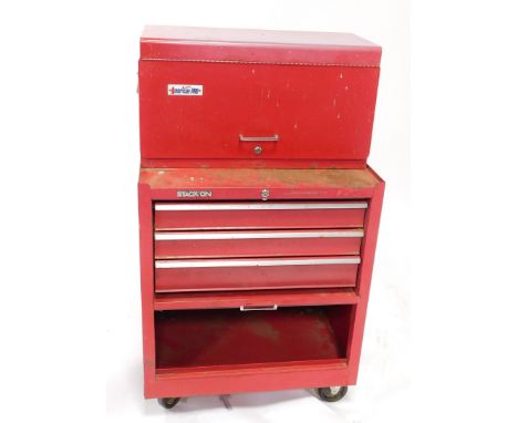 An American Pro Stack-On red metal tool chest, with an arrangement of various drawers, on castors, and some tools..