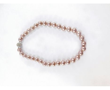 A simulated pearl necklace, with light pink lustre and knotted string strand, with diamonte finish, screw in clasp, 54cm long