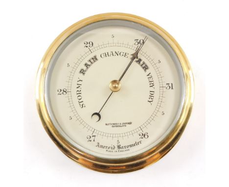 An early 20thC brass ship's aneroid barometer, by Hutchinson &amp; Jackson of Sunderland, 18.5cm diameter.