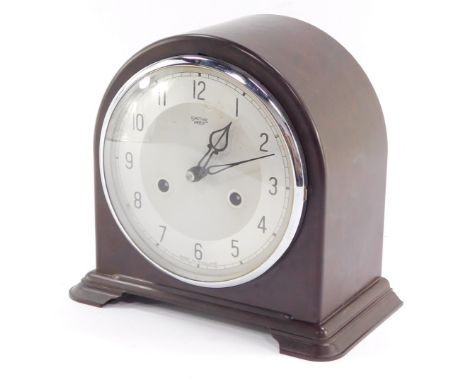 A Smiths Enfield early 20thC brown Bakelite case mantel clock, silver dial bearing Arabic numerals, eight day movement, with 