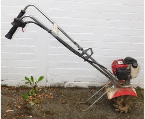 A Mantis rotovator with Honda engine.