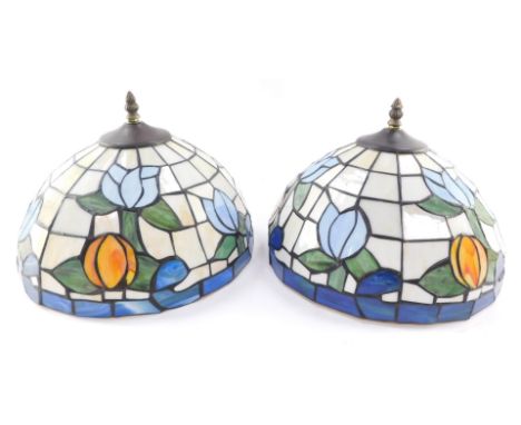 A pair of Tiffany style circular lamp shades, decorated with flowers, 31cm diameter.