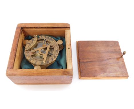 A brass compass by F L West, 31 Lockspur, London, boxed.