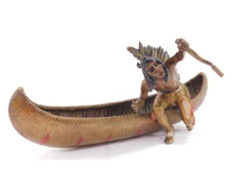 A Franz Bergman style cold painted bronze model of a Native American Indian, seated in a canoe, impressed mark and numbered 3