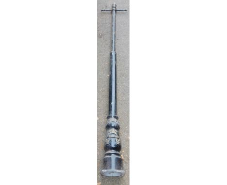 A black painted aluminium lamp post, decorated with scrolls, etc, incomplete, 250cm high.
