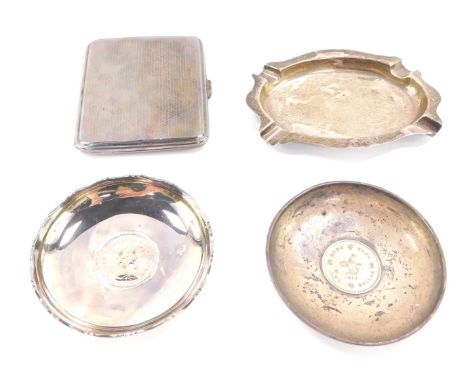 Silver, to include a George V engine turned cigarette case, London 1929, an oval ash tray, two silver pin dishes, each inset 