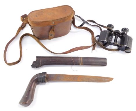 An Eastern dagger, with carved hardwood pistol type handle, and a pair of French binoculars. (2)