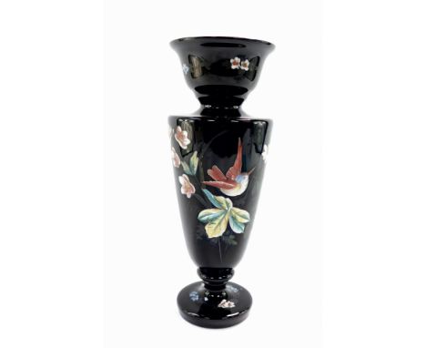 A Victorian black glass and enamel vase, decorated with figures of birds and flowers, of baluster form, 30cm high.