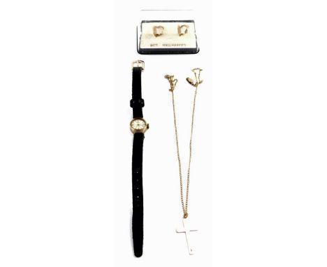 A 9ct gold cross on a neck chain, together with a pair of hoop earrings, 4.0g., and a Trident lady's 9ct gold cased wristwatc
