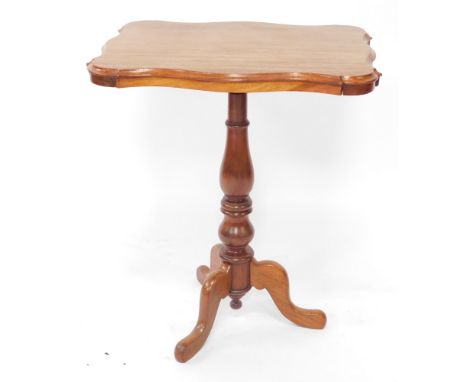 A Victorian mahogany occasional table, the rectangular top with a shaped moulded edge, on a turned column and tripod base, 62