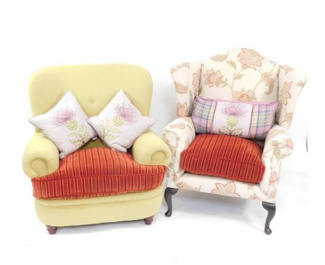 A floral upholstered wing back broad seated armchair on cabriole legs, and another button back example, both with matching st