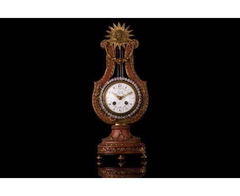 Causard, Hrg du Roy (Paris 1890-1910) a Louis XV style rose pink marble and ormolu mounted, 8-day lyre clock with "Sun King" 