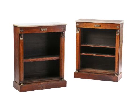 A pair of Empire style figured dwarf open bookcases, 19th century, but adapted from a larger item, with white marble tops, mo