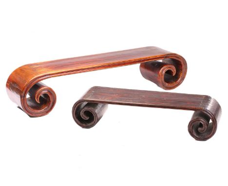 A Chinese red elm and native walnut scroll end low opium table, 20th century, with moulded edge together with one similar but