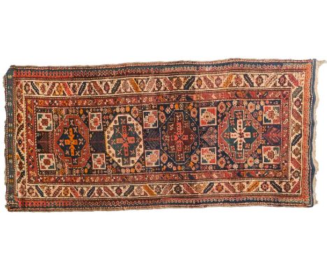 An indigo blue ground Karachov Kazak long rug, first half of the 20th century, with four geometric lozenges within an arrow h