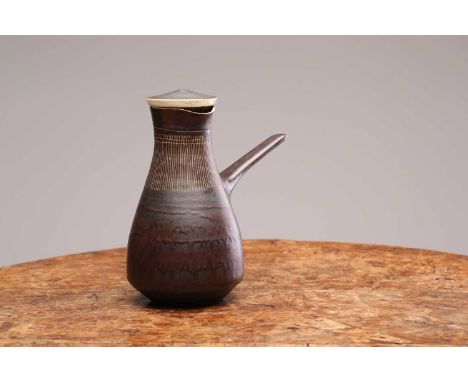 Lucie Rie (1902-1995), a manganese glaze coffee pot, with vertical incised decoration to the collar, impressed stamp to base,