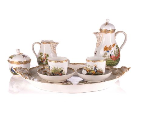 A late 19th or early 20th century Berlin porcelain tete-a-tete coffee set, each item painted with birds and insects gilt high