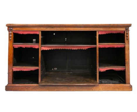 An early Victorian figured rosewood three-bay open bookcase with lotus flower and harebell applied carvings and housing six a