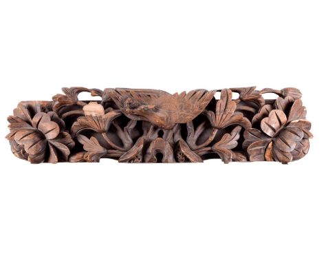 A Chinese heavily carved walnut architectural panel, possibly a door lintel, Qing Dynasty, 19th century. With deeply carved w