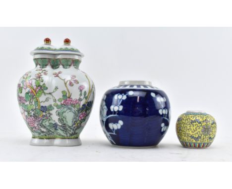 Three 20th century Chinese ceramic pieces. The lot to include a conjoined famille rose vase with lid, decorated with flowers 