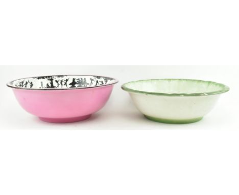 Two early to mid 20th century large ceramic washbowls. The lot comprising a bowl with pink exterior, crackled glazed cream in