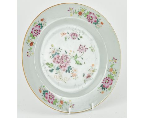 A Qing dynasty Qianlong period famille rose ceramic plate. The plate decorated with peonies and bouquets of flowers in the ce