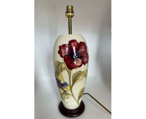 Moorcroft Pottery lamp base in Hibiscus pattern on cream ground. Height 43cmCondition crazing to background