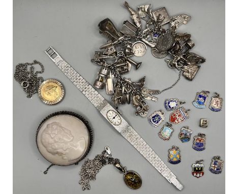 A Sterling silver charm bracelet (gross weight approximately 92.4 grams), containing more than 30 charms (many of which are a