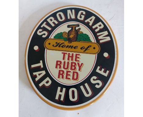 An oval pub sign "Strongarm Tap House, Home of ruby red", 37cm x 32cm