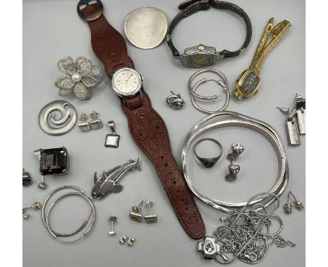 A selection of silver and white metal jewellery, featuring a Georg Jensen double dolphin brooch designed by Arno Malinowski, 
