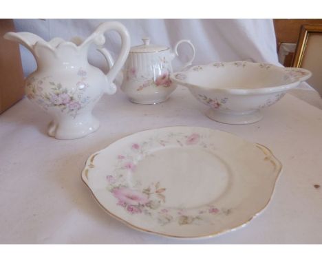 A Royal Stafford and a Minton part dinner service to include tea pot plates cups and saucers as well ad soup bowls, a comport